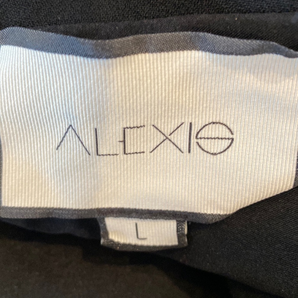Alexis black off the shoulder top with silver zipper in back and bell sleeves